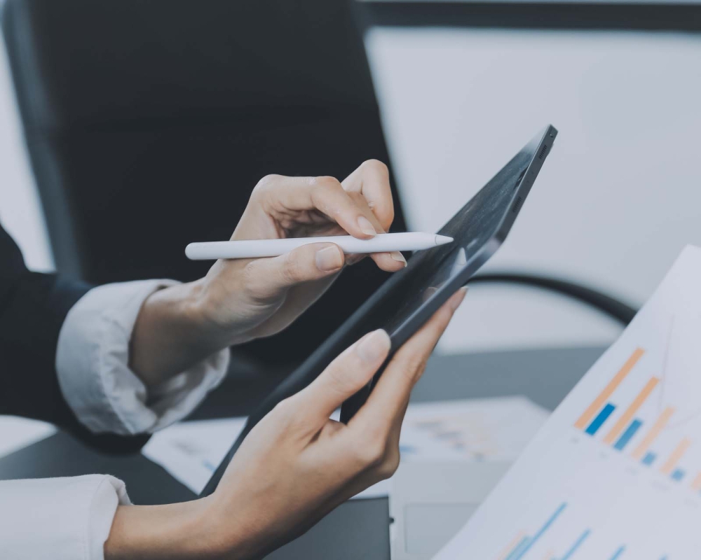 Close up of Business team analyzing income charts and graphs with modern laptop computer. Business analysis and strategy concept.